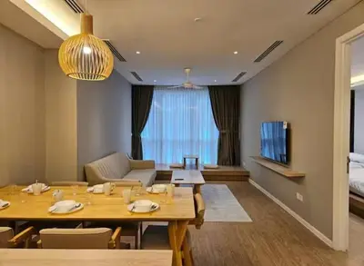 a living room with a table and a couch and a television at New Soho Binjai 8 KLCC in Kuala Lumpur