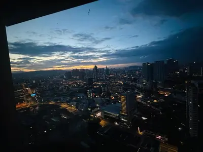 a view of a city skyline at night at Times Square Service Apartment KL in Kuala Lumpur