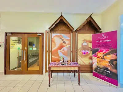 a store front with a table in front of a sign at Times Square Service Apartment KL in Kuala Lumpur