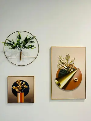 three framed pictures of plants on a wall at Agile Family Suites -TRX Kualalampur in Kuala Lumpur