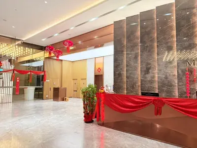 a lobby with a red curtain and a red table at Next To KLCC By Home Stay in Kuala Lumpur