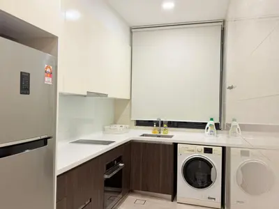 a kitchen with a washer and dryer in it at Home Town Next To Kuala Lumpur City in Kuala Lumpur