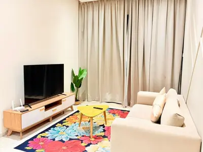a living room with a couch and a tv at Home Town Next To Kuala Lumpur City in Kuala Lumpur