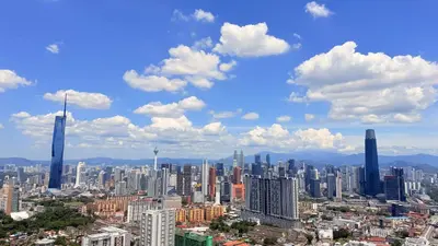 a view of a large city with tall buildings at The Grand Suites - Trion KL in Kuala Lumpur