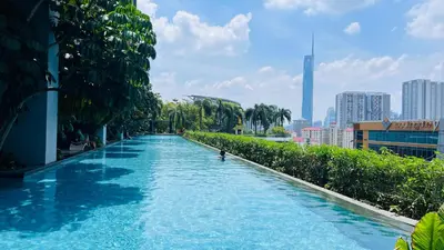 a swimming pool with a person in the middle at The Grand Suites - Trion KL in Kuala Lumpur