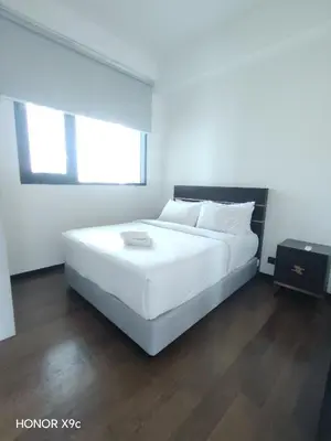 a large white bed in a white room at Opus Residence KL118 By Millennium Suite in Kuala Lumpur