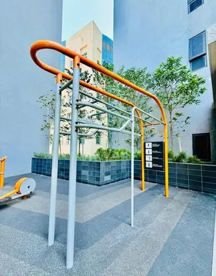 an orange and white rail next to a building at Agile Residence Kuala Lumpur Bukit Bintang in Kuala Lumpur