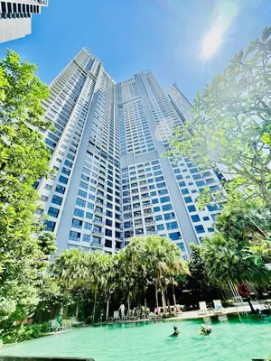 a large building with people in the water in front of it at Agile Residence Kuala Lumpur Bukit Bintang in Kuala Lumpur