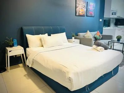 a bedroom with a large bed with a stuffed animal on it at Lux Retreat Home At Mercu Summer in Kuala Lumpur