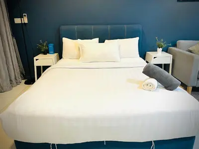 a large white bed with a stuffed animal on it at Lux Retreat Home At Mercu Summer in Kuala Lumpur