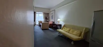 a living room with a couch and chairs in a room at Kuala Lumpur Service suite times square s in Kuala Lumpur