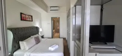 a small room with a couch and a television at Kuala Lumpur Service suite times square s in Kuala Lumpur