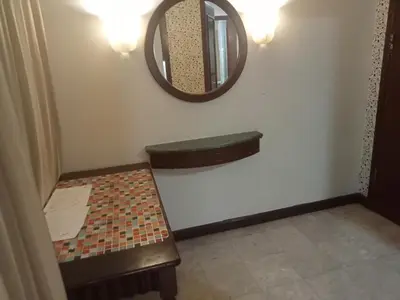 a bathroom with a toilet and a mirror at RKSON SUITE At KL in Kuala Lumpur