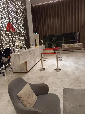 a lobby with a couch and a table in a room at Presidential Suite Quill Residence KLCC in Kuala Lumpur