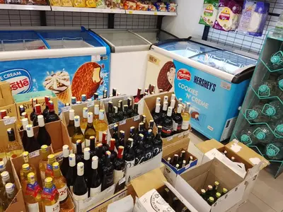 a display of wine bottles in boxes in a store at Mix Home At Chamber Residence in Kuala Lumpur