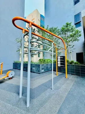 an orange and white railing in front of a building at Agile Residence By Infinity Pool in Kuala Lumpur