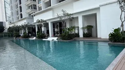 a swimming pool in front of a building at Kuala Lumpur Quill Residences By AR Stay in Kuala Lumpur