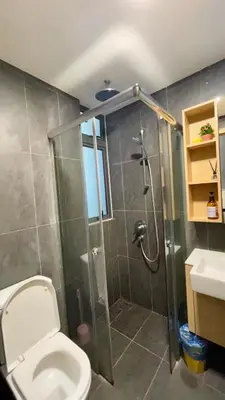 a bathroom with a shower and a toilet and a sink at The Colony SkyView KLCC by Alaman in Kuala Lumpur
