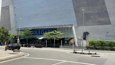 a car parked in front of a building at The Colony SkyView KLCC by Alaman in Kuala Lumpur