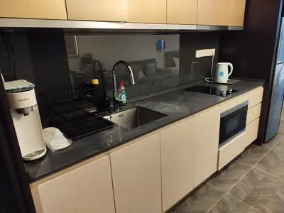 a kitchen with a sink and a counter top at Scarletz suites Klcc by Sunlight in Kuala Lumpur