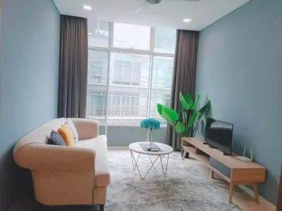 a living room with a couch and a tv at SKY SUiTES KLCC BY RT GROUP in Kuala Lumpur