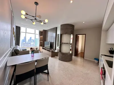 a kitchen and living room with a table and chairs at SKY SUiTES KLCC BY RT GROUP in Kuala Lumpur