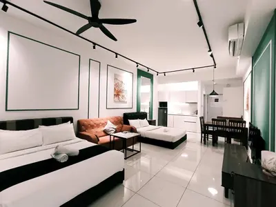 a living room with two couches and a ceiling fan at Chamber Residence KlCC by Royal Empire in Kuala Lumpur