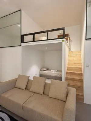 a living room with a couch and a bunk bed at Relax and cozy, entire unit in Kuala Lumpur