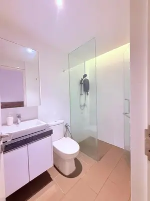 a bathroom with a toilet and a sink and a shower at Relax and cozy, entire unit in Kuala Lumpur