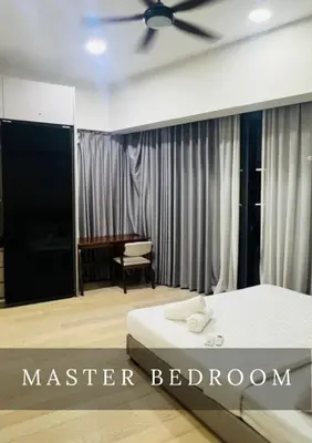a master bedroom with a bed and a desk at Urban Star Residence KLCC in Kuala Lumpur