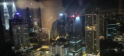 a view of a city skyline at night at Elite Suites at Agile Bukit Bintang Kuala Lumpur in Kuala Lumpur