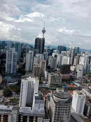 a view of a city with skyscrapers and the space needle at Realty Services Suites at Berjaya Times Square in Kuala Lumpur
