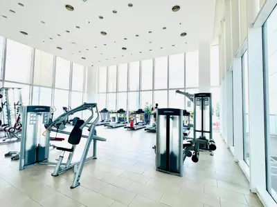 a gym with cardio equipment in a large building at The Grand klcc at platinum face in Kuala Lumpur