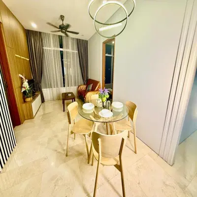 a dining room with a table and chairs at Sky klcc by DMK luxury suites Apartment in Kuala Lumpur