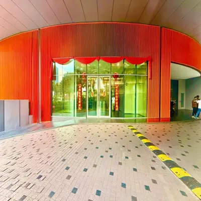 a building with red walls and a glass door at Sky klcc by DMK luxury suites Apartment in Kuala Lumpur