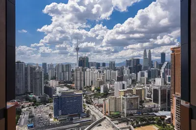 a view of a city from a skyscraper at Glowing Star Home Infinity Swimming Pool By Lalaport in Kuala Lumpur
