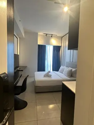 a hotel room with a bed and a kitchen at Luxury Residence At Axon in Kuala Lumpur
