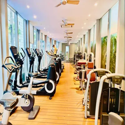 a gym with rows of treadmills and cardio machines at Vortex klcc by DMK Luxury suites Apartment in Kuala Lumpur