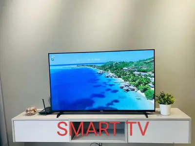 a flat screen tv sitting on top of a tv stand at Star Residences Suites Home in Kuala Lumpur
