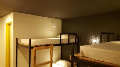 a room with two bunk beds in a room at Revopackers Beds and Bunks in Kuala Lumpur