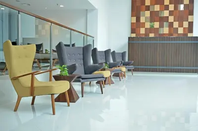 a row of chairs and tables in a waiting room at Verdant Hill Hotel Kuala Lumpur in Kuala Lumpur