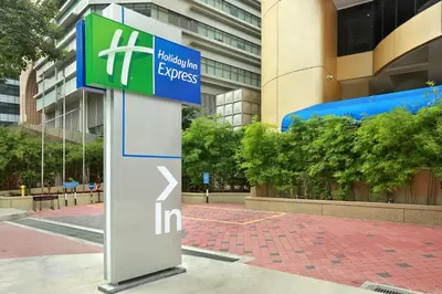 a sign in front of a building at Holiday Inn Express Kuala Lumpur City Centre by IHG in Kuala Lumpur
