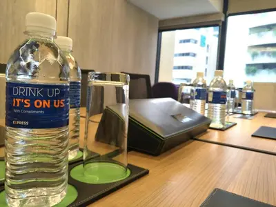 a bottle of water sitting on top of a table at Holiday Inn Express Kuala Lumpur City Centre by IHG in Kuala Lumpur