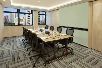 a conference room with a long table and chairs at Holiday Inn Express Kuala Lumpur City Centre by IHG in Kuala Lumpur