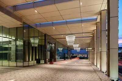 a rendering of a building hallway with chandeliers at The St. Regis Kuala Lumpur in Kuala Lumpur