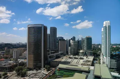 a view of a city skyline with tall buildings at The St. Regis Kuala Lumpur in Kuala Lumpur