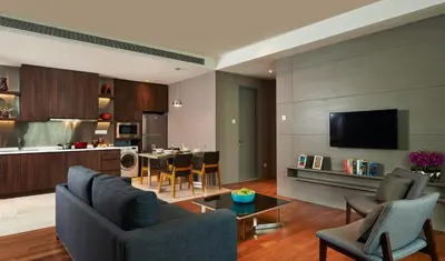 a living room with a couch and a table at VE Hotel & Residence in Kuala Lumpur