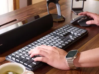 a person is typing on a computer keyboard at Shangri-La Kuala Lumpur in Kuala Lumpur