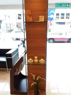 a wooden shelf with food on it with a bus at NU Hotel @ KL Sentral in Kuala Lumpur