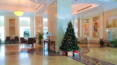 a christmas tree in the middle of a lobby at Parkview KLCC Serviced Suites in Kuala Lumpur